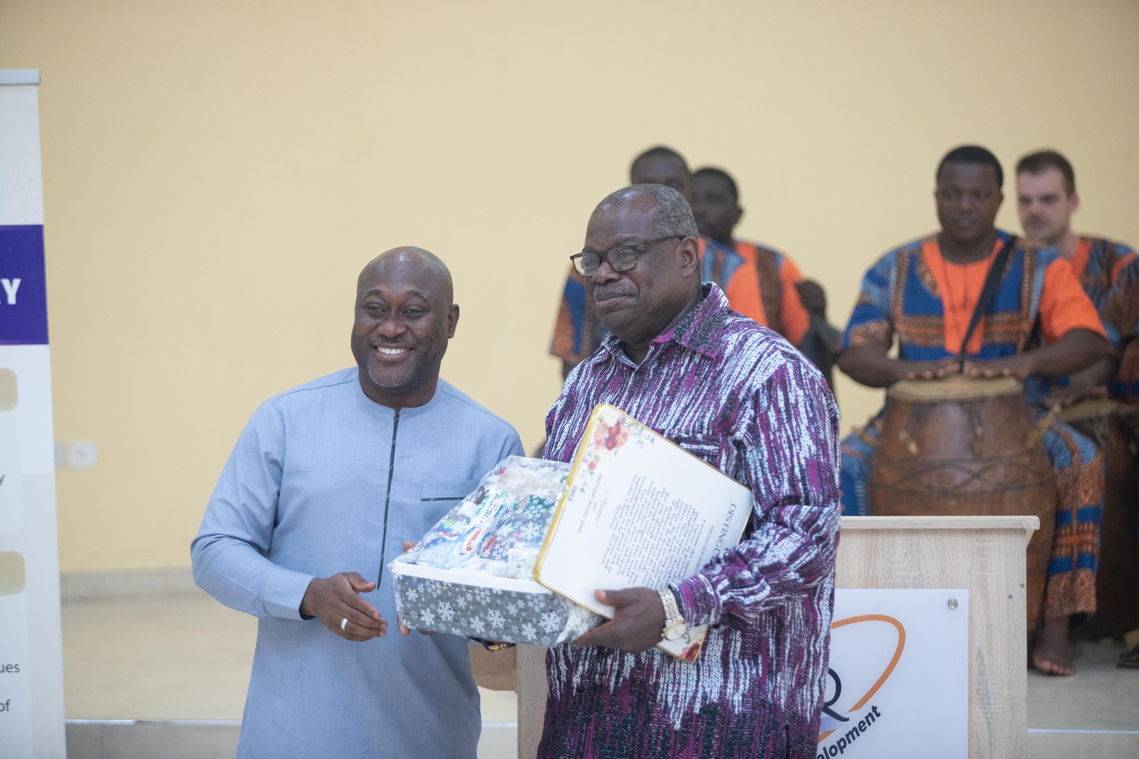 Prof. Gordon Awandare, Pro-Vice-Chancellor, Academic and Student Affairs presenting a citation to Emeritus Prof. Ernest Aryeetey, former Vice-Chancellor.