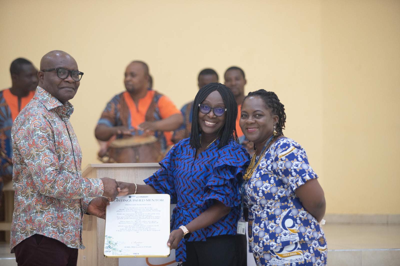 Prof. Dan Frimpong Ofori, Provost, College of Humanities presenting a citation to one of the honoured mentors